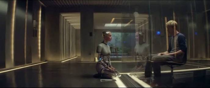 Caleb observing Ava through glass